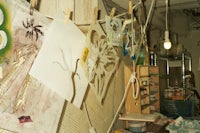 a room with a lot of art hanging on the wall